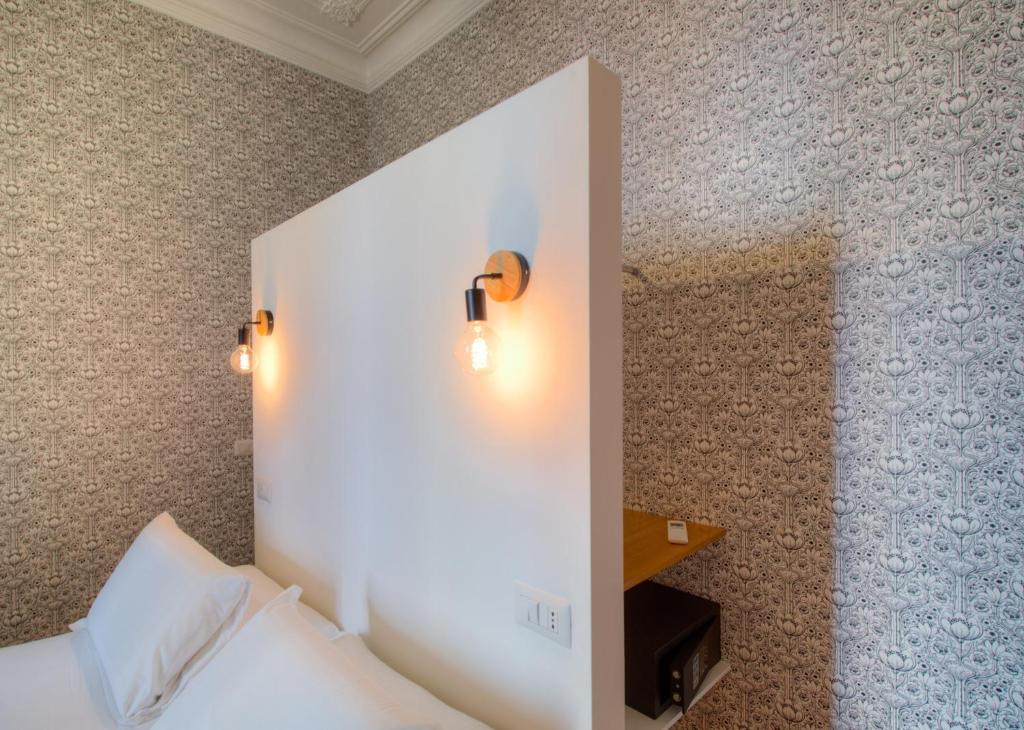 Posteľ alebo postele v izbe v ubytovaní App Beccaria Apartments in Rome