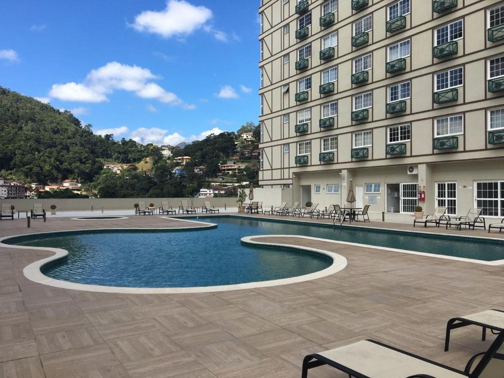 Swimmingpoolen hos eller tæt på Flat Conforto em Itaipava