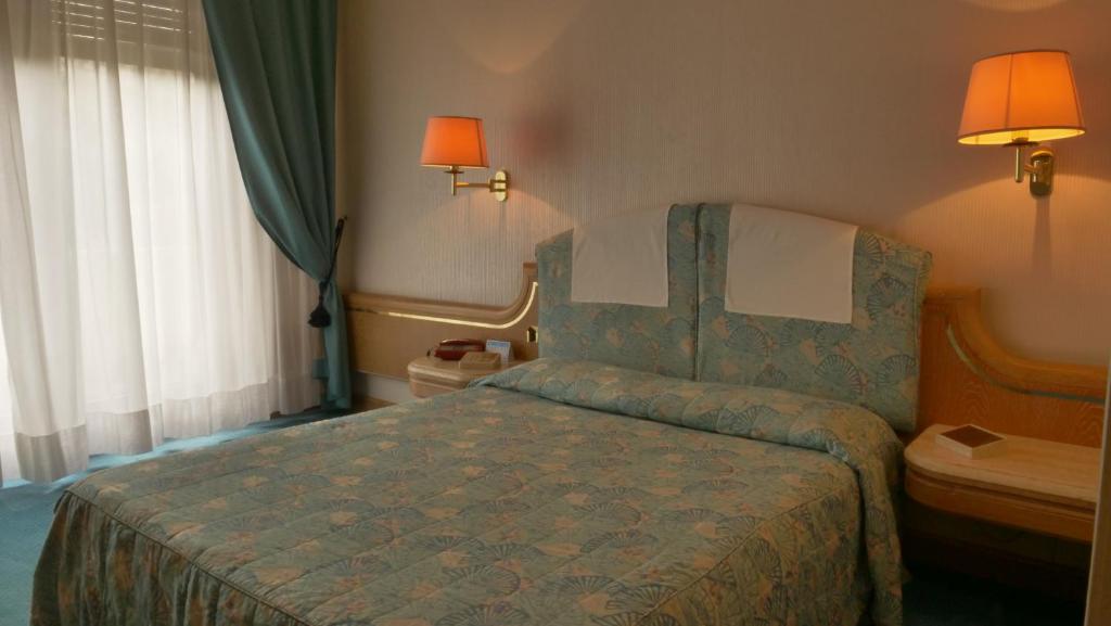 Postel nebo postele na pokoji v ubytování 501 Hotel