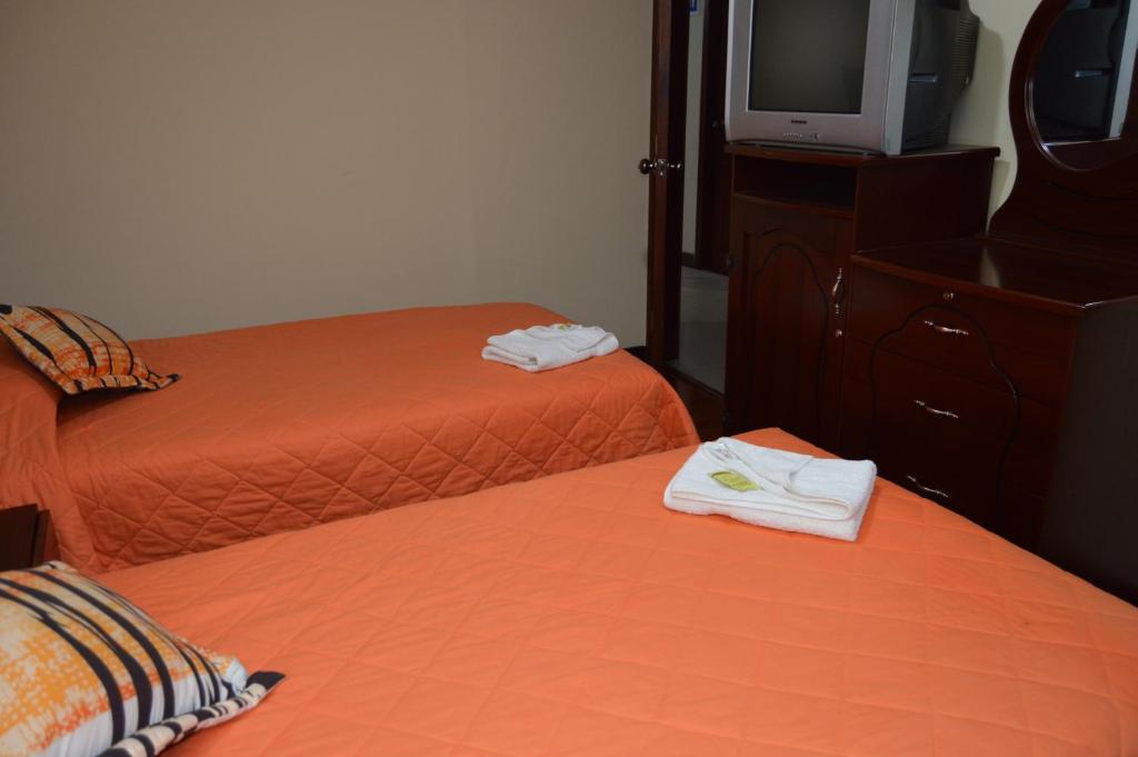Postel nebo postele na pokoji v ubytování Balcones del Río Hotel