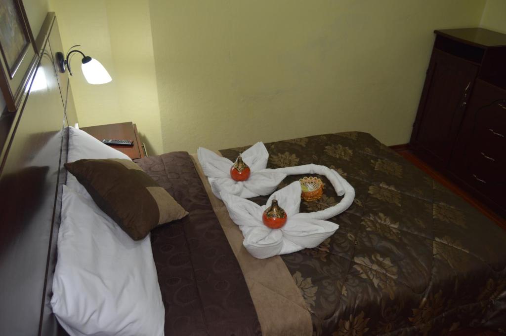 Postel nebo postele na pokoji v ubytování Balcones del Río Hotel