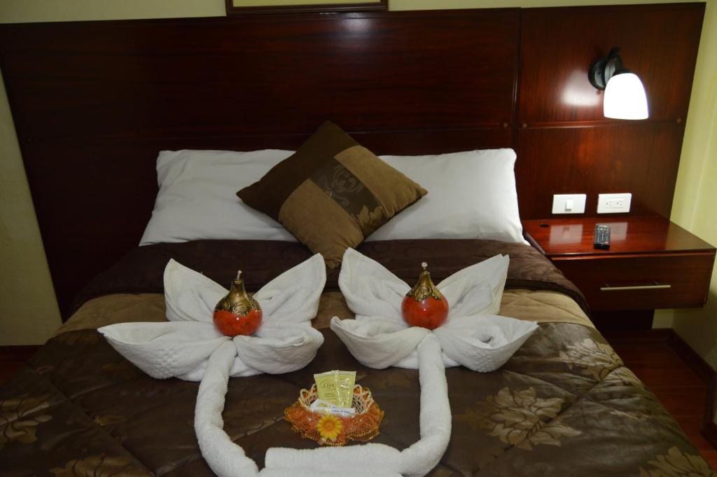 Postel nebo postele na pokoji v ubytování Balcones del Río Hotel