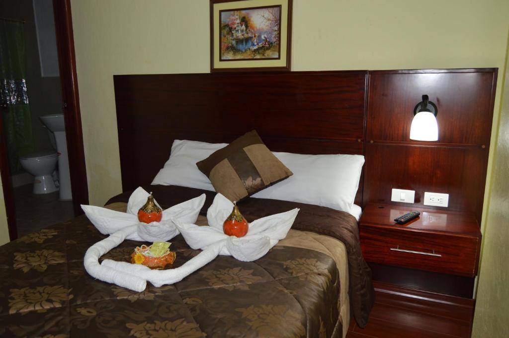Postel nebo postele na pokoji v ubytování Balcones del Río Hotel