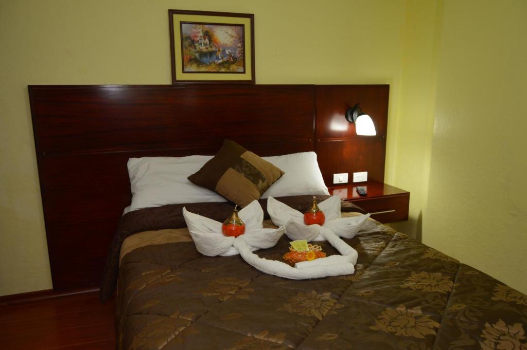 Postel nebo postele na pokoji v ubytování Balcones del Río Hotel