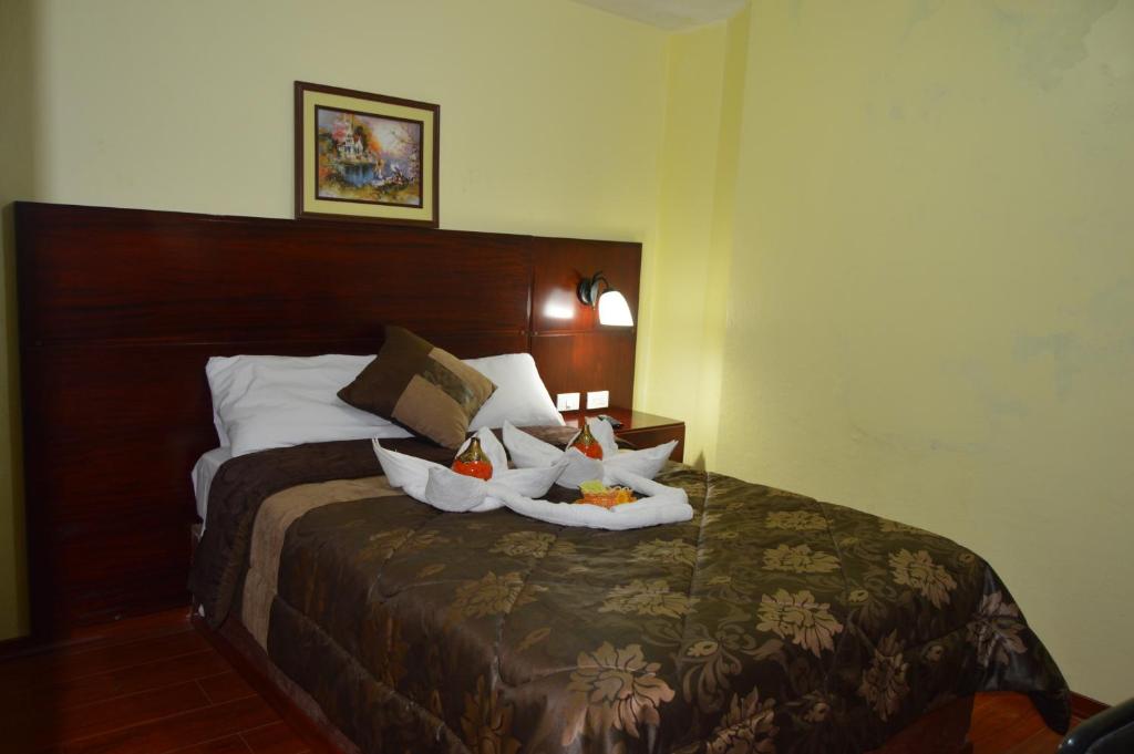Postel nebo postele na pokoji v ubytování Balcones del Río Hotel