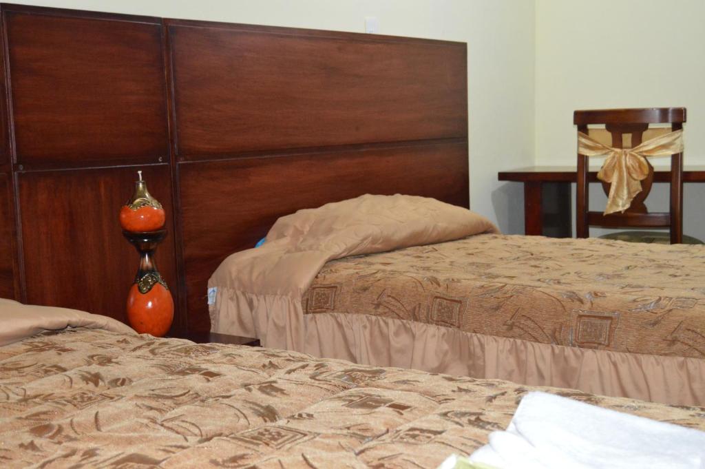 Postel nebo postele na pokoji v ubytování Balcones del Río Hotel