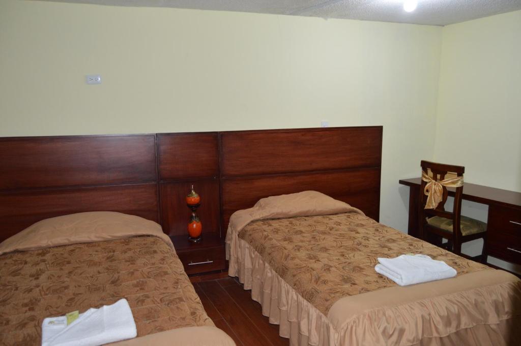 Postel nebo postele na pokoji v ubytování Balcones del Río Hotel