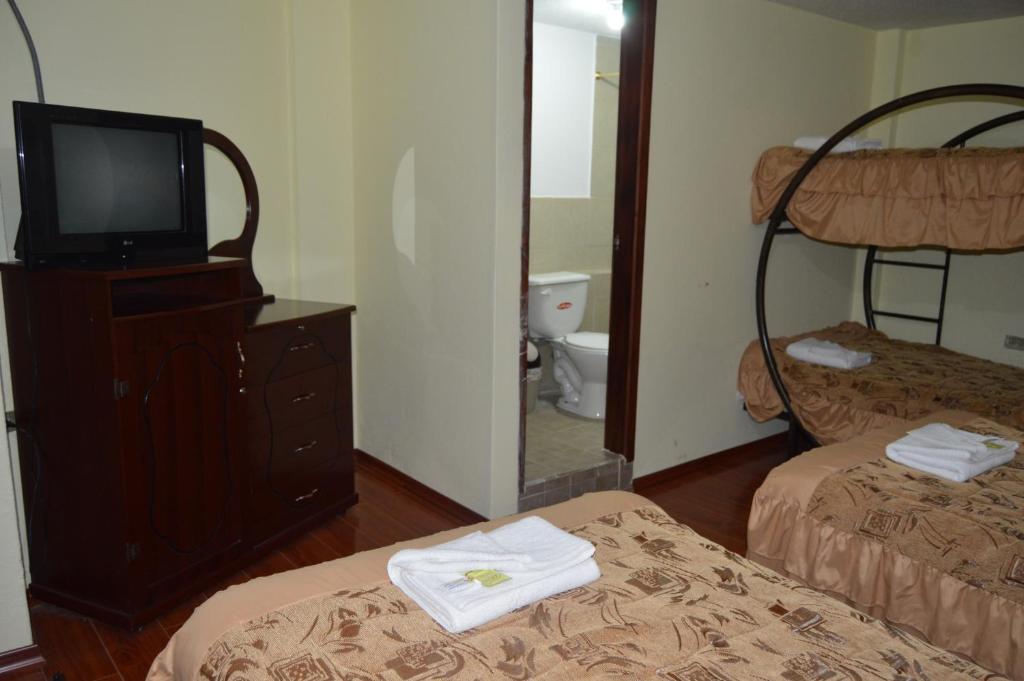 Postel nebo postele na pokoji v ubytování Balcones del Río Hotel