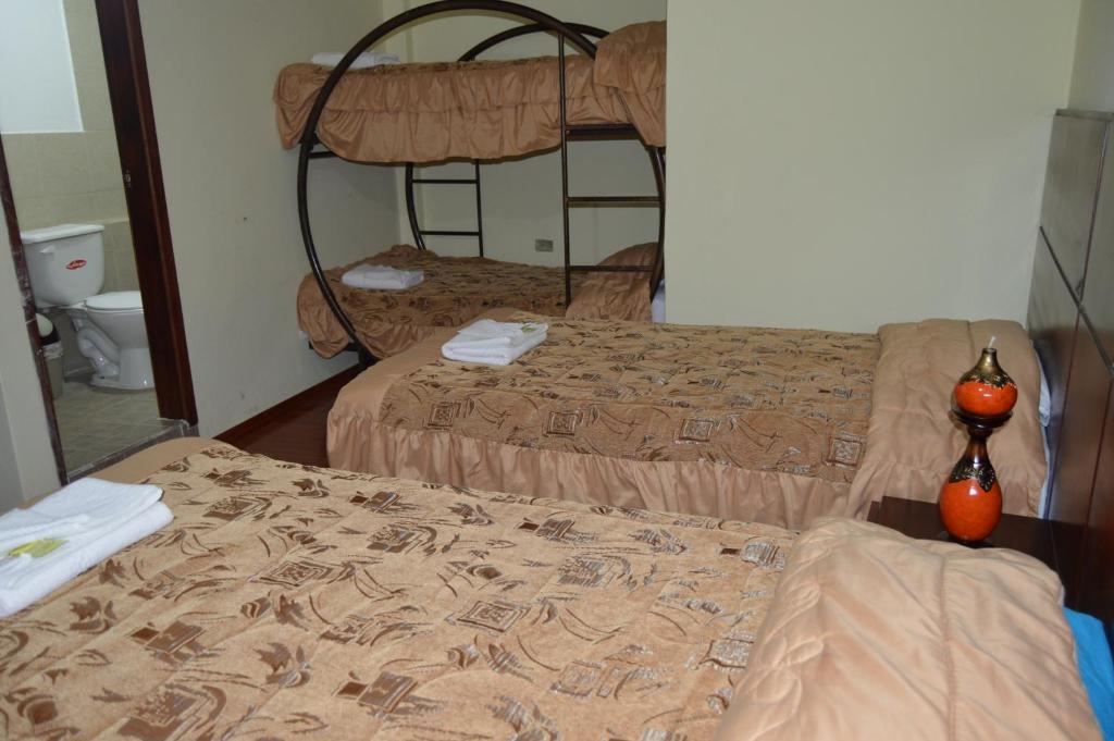 Postel nebo postele na pokoji v ubytování Balcones del Río Hotel