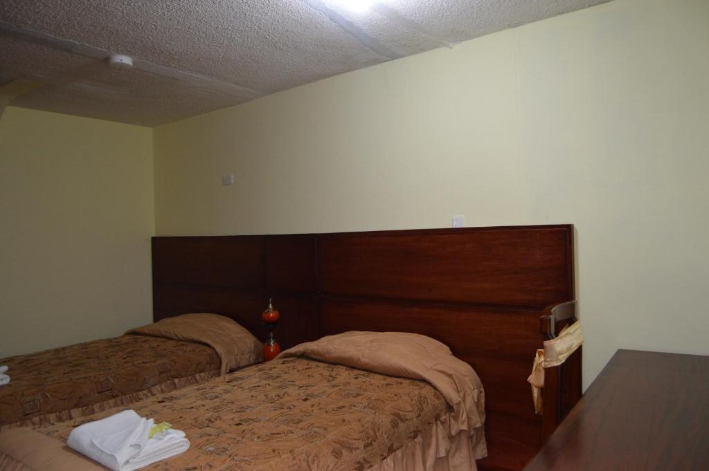 Postel nebo postele na pokoji v ubytování Balcones del Río Hotel
