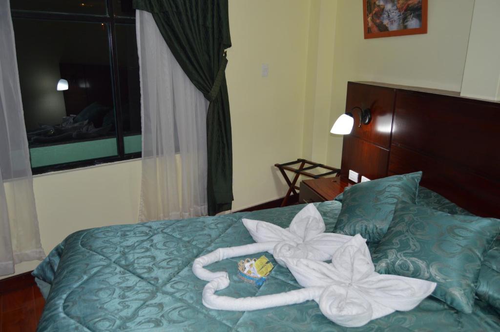 Postel nebo postele na pokoji v ubytování Balcones del Río Hotel