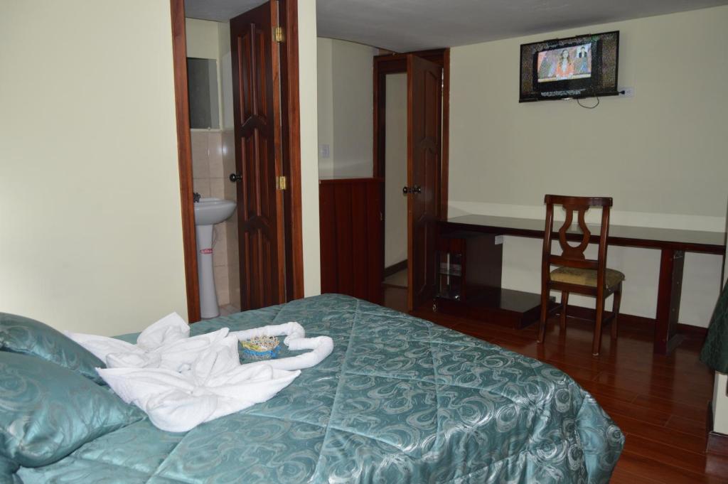 Postel nebo postele na pokoji v ubytování Balcones del Río Hotel
