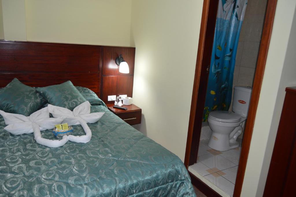 Postel nebo postele na pokoji v ubytování Balcones del Río Hotel