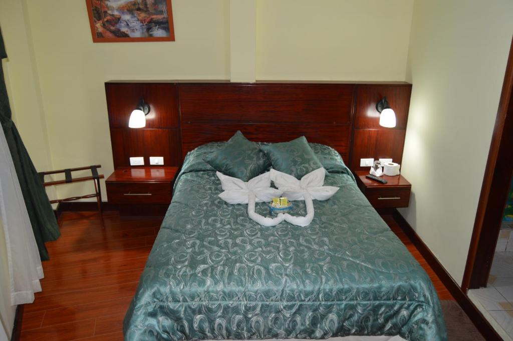 Postel nebo postele na pokoji v ubytování Balcones del Río Hotel