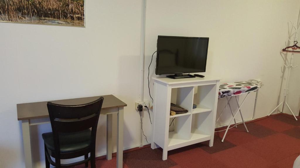 TV a/nebo společenská místnost v ubytování Kurau Inn Farmstay