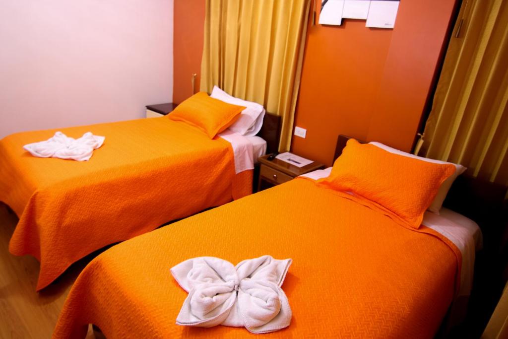 Postel nebo postele na pokoji v ubytování Hostal Alpachaca - New Quito Airport