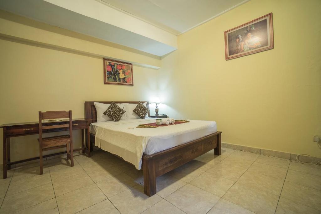 Postel nebo postele na pokoji v ubytování Tegar Guest House Ubud