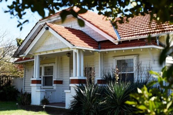 a small white house with a red roof at The Californian in Benalla