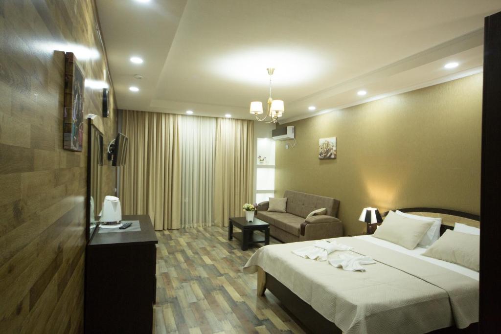 Postel nebo postele na pokoji v ubytování Hotel Dimasi