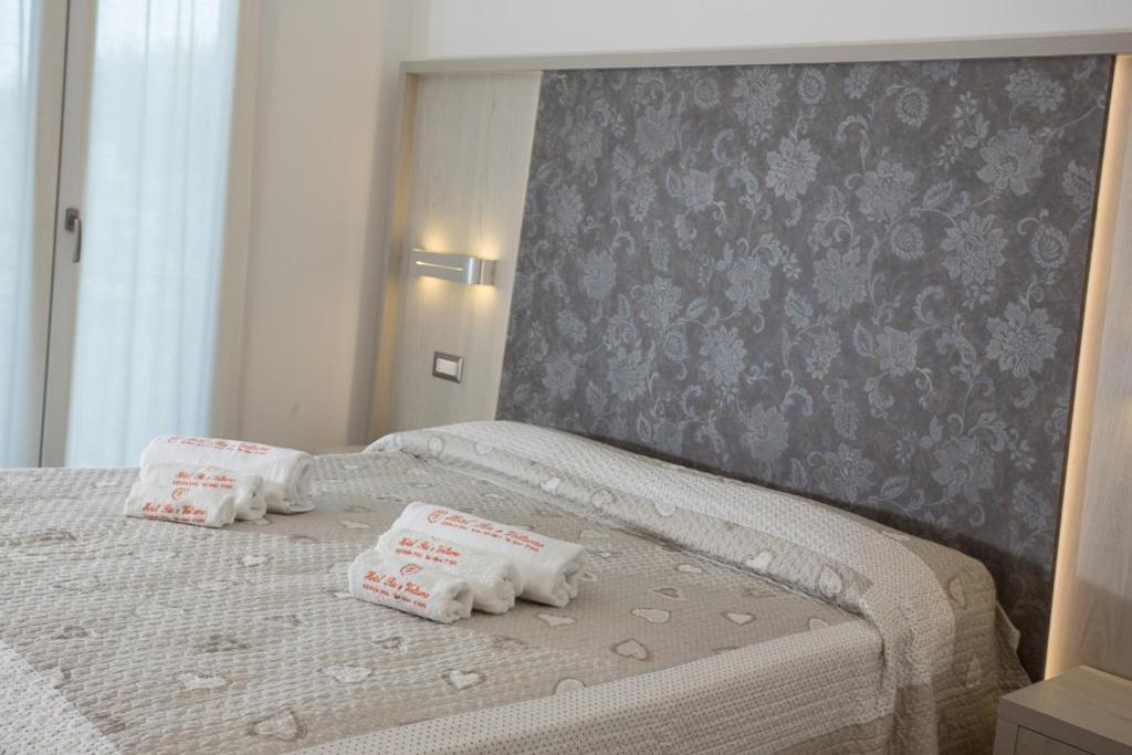 Postel nebo postele na pokoji v ubytování Hotel Riz