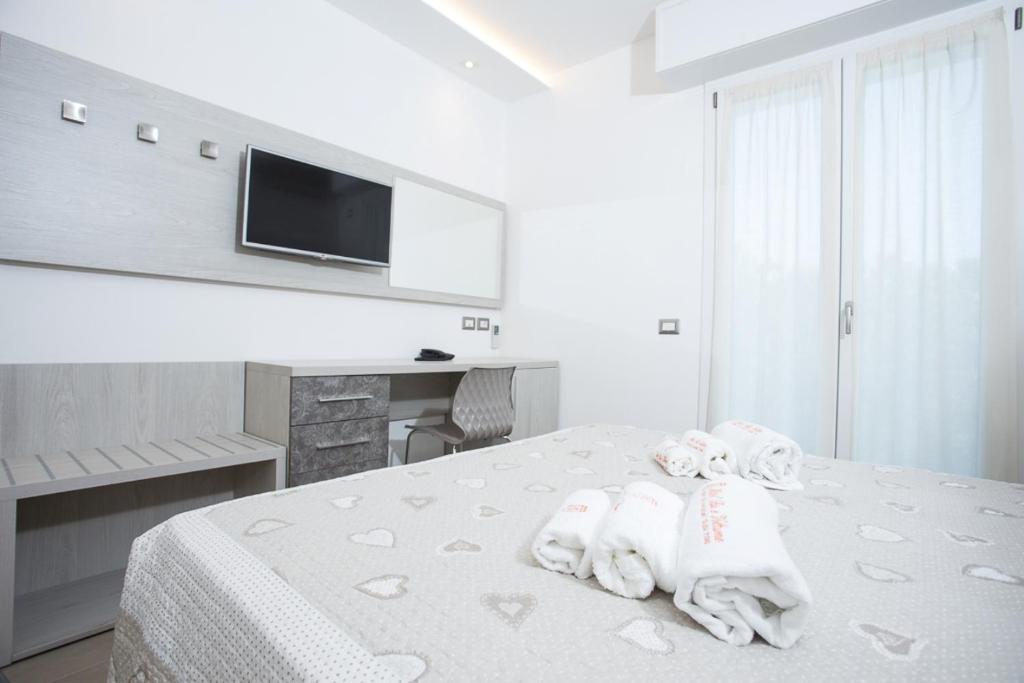 Postel nebo postele na pokoji v ubytování Hotel Riz