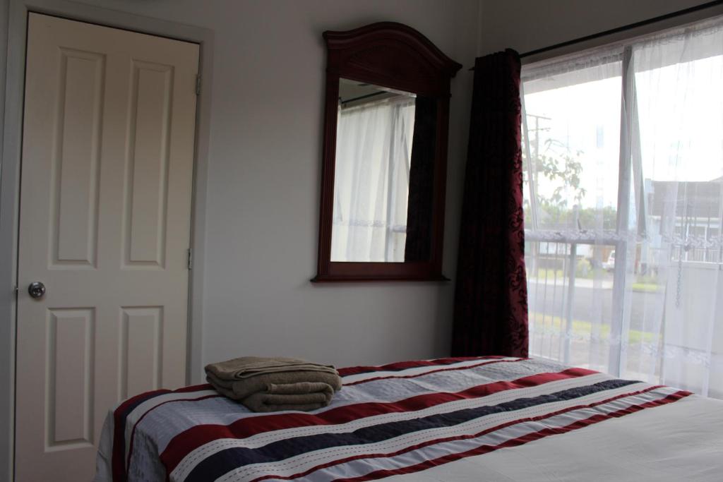 Postel nebo postele na pokoji v ubytování Mini Homestay