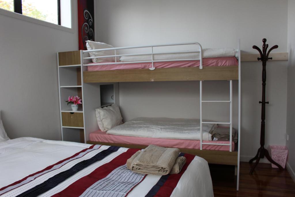 Postel nebo postele na pokoji v ubytování Mini Homestay