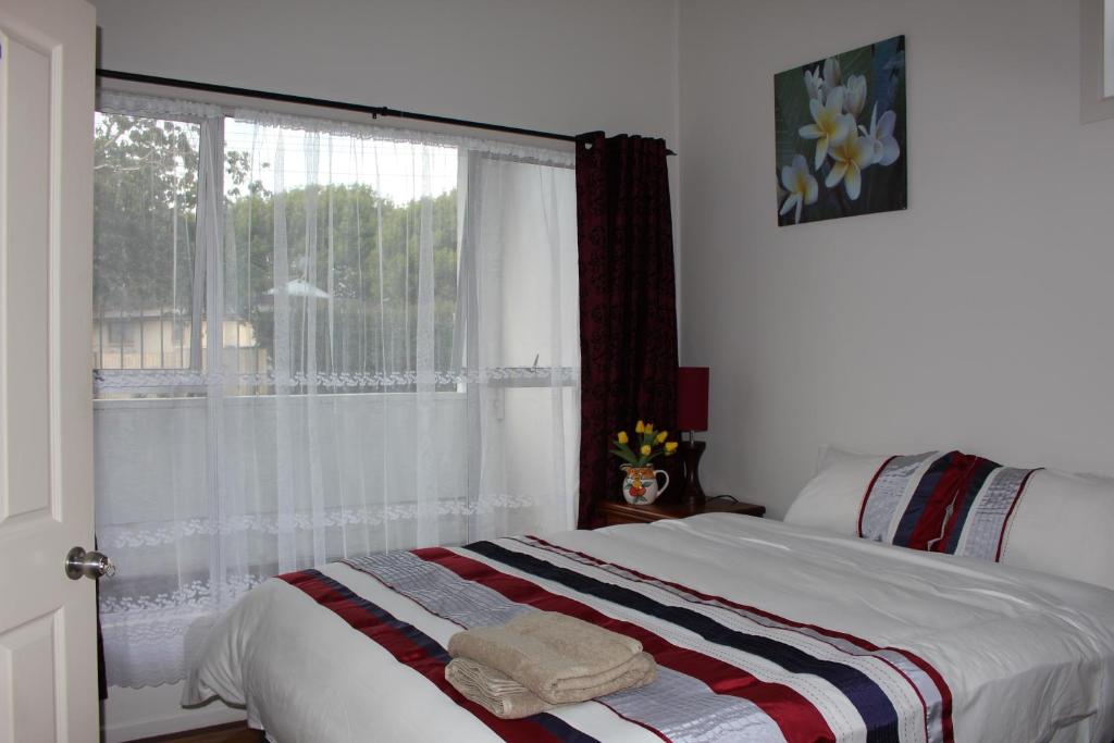 Postel nebo postele na pokoji v ubytování Mini Homestay