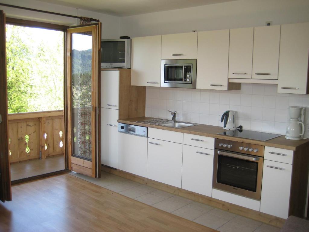 Kuchyň nebo kuchyňský kout v ubytování Apartments Spiegl Holzmann