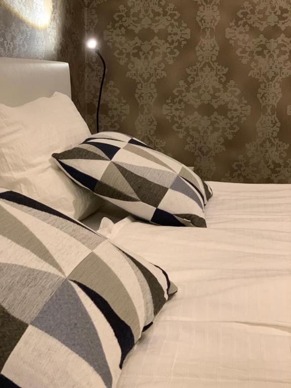 Postel nebo postele na pokoji v ubytování Apartment Center