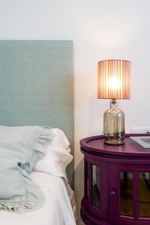 Postel nebo postele na pokoji v ubytování Apartamentos RG Plaza de España