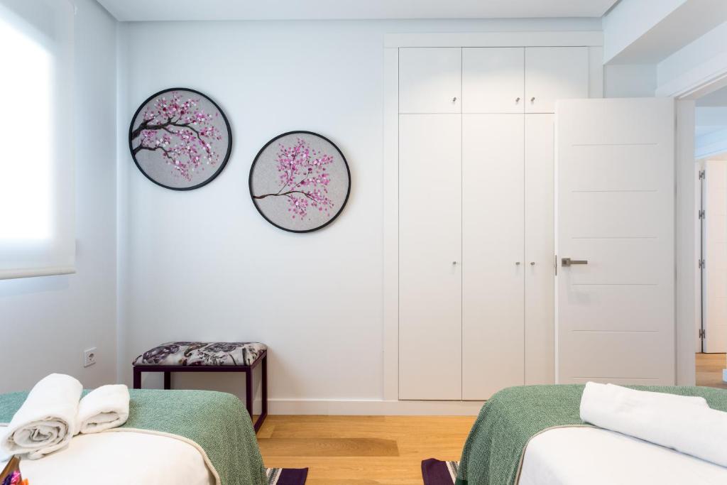 Postel nebo postele na pokoji v ubytování Apartamentos RG Plaza de España