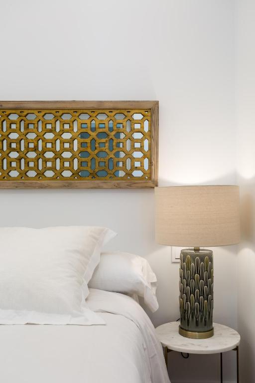 Postel nebo postele na pokoji v ubytování Apartamentos RG Plaza de España