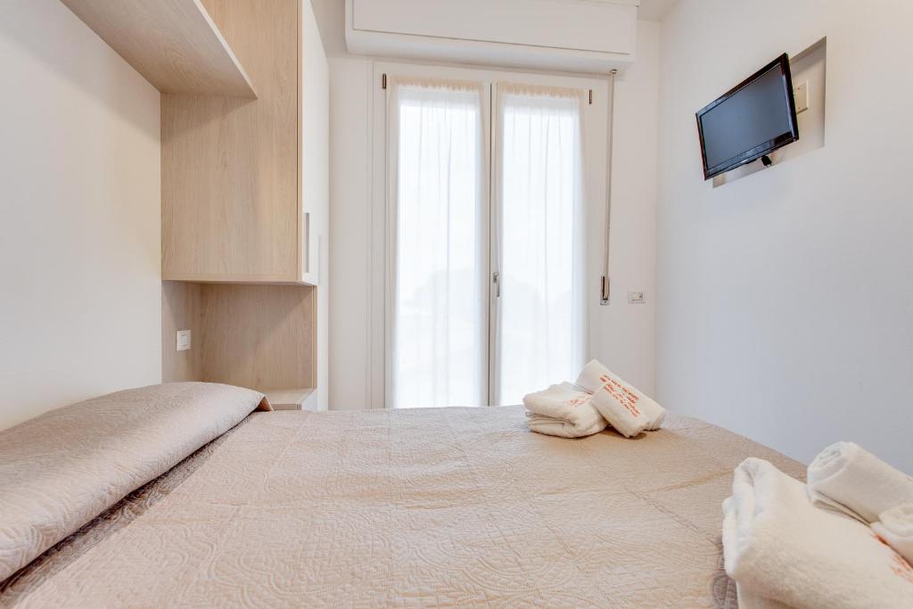 Postel nebo postele na pokoji v ubytování Hotel Riz