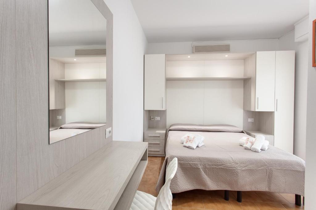 Postel nebo postele na pokoji v ubytování Hotel Riz
