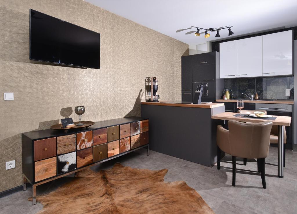 TV a/nebo společenská místnost v ubytování Aparthotel-Stadtallendorf