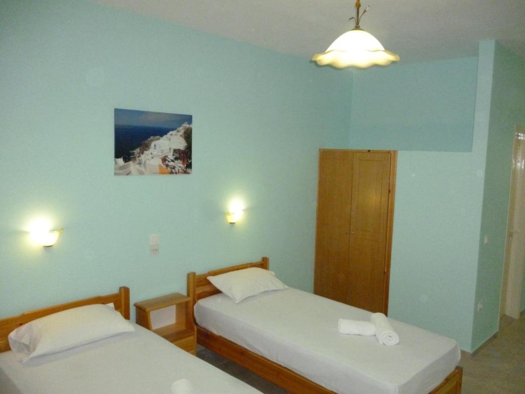 Postel nebo postele na pokoji v ubytování Alexandros Guest House