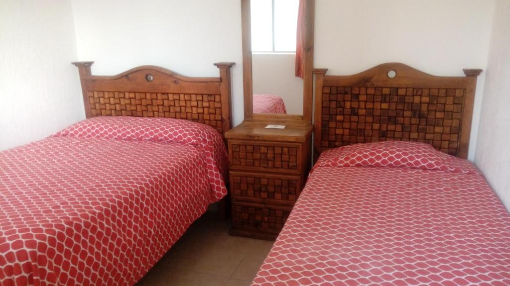 Postel nebo postele na pokoji v ubytování La Sirenita