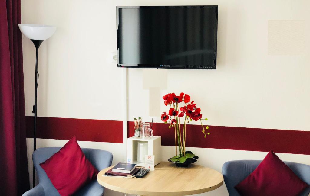 TV a/nebo společenská místnost v ubytování Hotel Condor