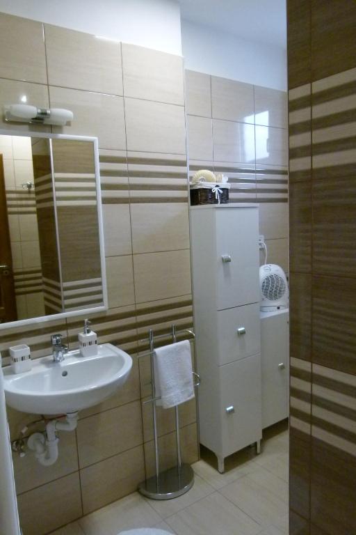 Koupelna v ubytování Wolf House Apartman