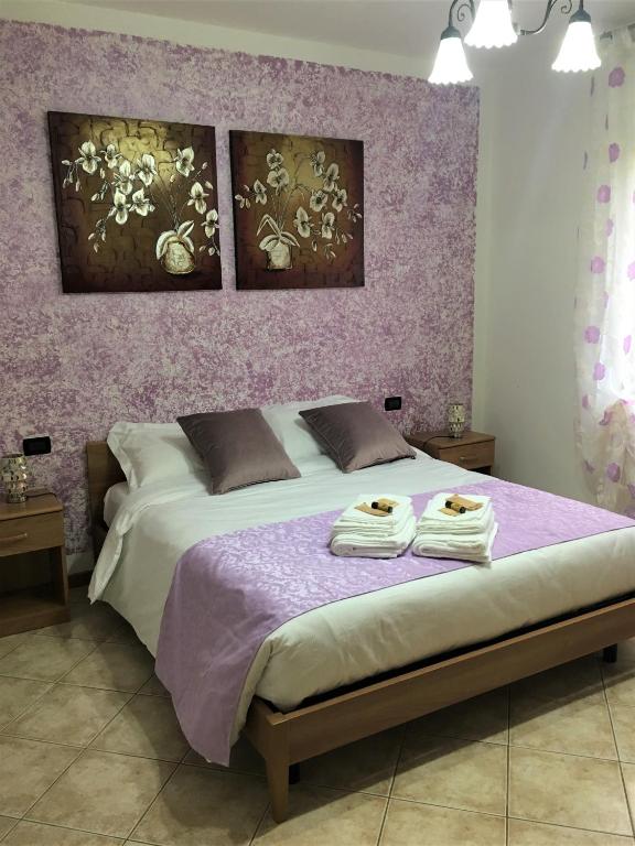 Posteľ alebo postele v izbe v ubytovaní La casa di Paola