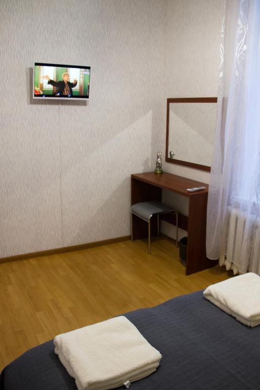 Postel nebo postele na pokoji v ubytování Хостел и Апартаменты Друзья