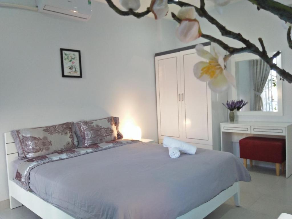 Giường trong phòng chung tại Lehome Serviced Apartment-Binh Thanh Dist