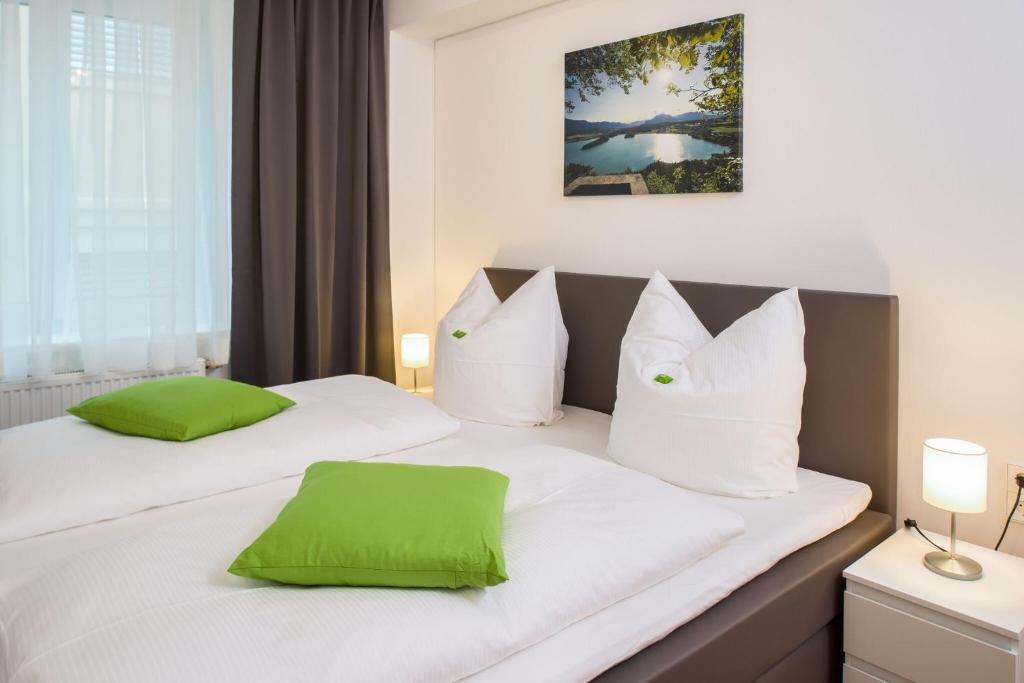 Postel nebo postele na pokoji v ubytování City Appartements Villach