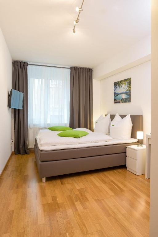 Postel nebo postele na pokoji v ubytování City Appartements Villach