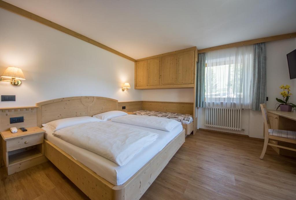 Postel nebo postele na pokoji v ubytování Garni Miriam