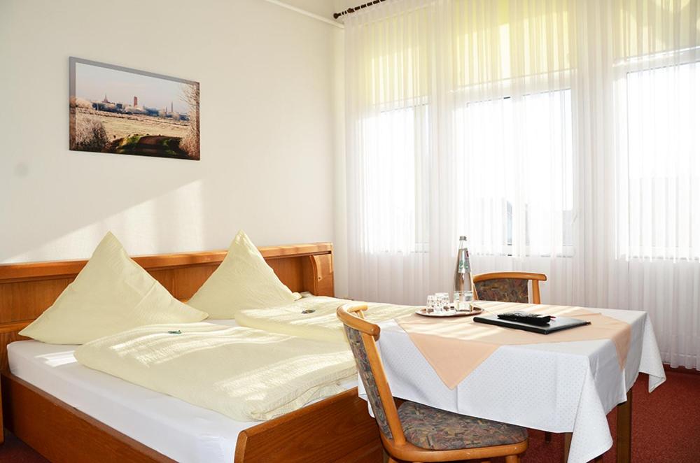 Postel nebo postele na pokoji v ubytování Hotel Rummeni