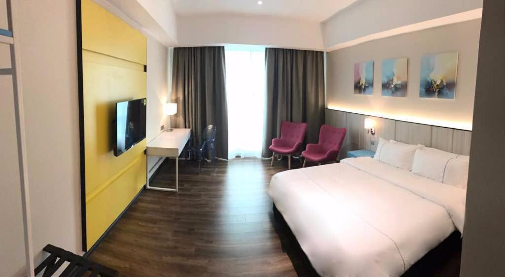 TV a/nebo společenská místnost v ubytování Higher Hotel