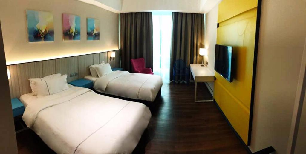 Postel nebo postele na pokoji v ubytování Higher Hotel