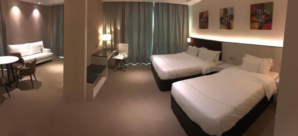 Postel nebo postele na pokoji v ubytování Higher Hotel